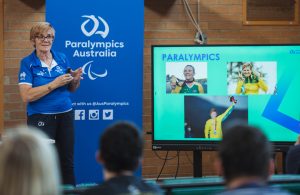 Australian Paralympian Carol Cooke talking in front of a class of students